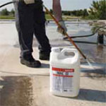 Professional Membrane Coating System Application - Step 1 - Power wash and clean with WAC II®.roof cleaner