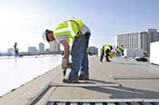 Single Ply Roof Membrane System - Step 1 - Remove all loose dirt and debris and install board stock.