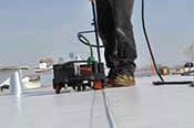 Single Ply Roof Membrane System - Step 3 - Seams are heat welded together making the rubber-to-rubber bond unbreakable.